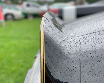 Close-up of wet car during rainy season