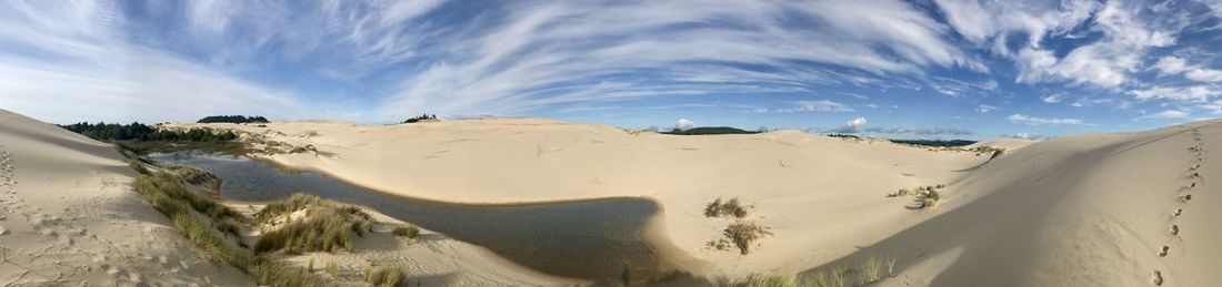 Panoramic view of desert against sky