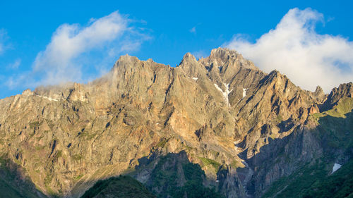 Panoramic view of mountain range against sky