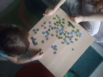 High angle view of girl holding hands