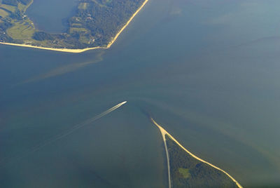 Aerial view of airplane wing against sky