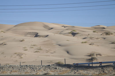 Sand dunes on a desert highway