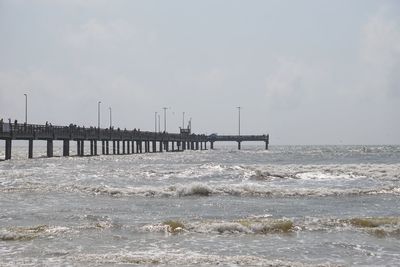 Pier over sea against sky