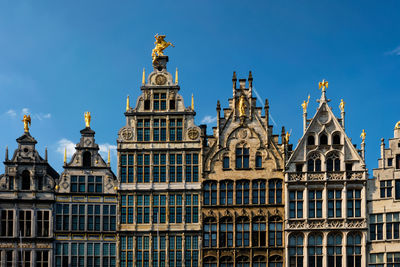 Low angle view of building against blue sky