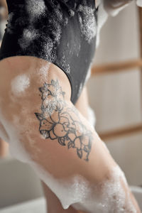 Woman tattoo on a leg