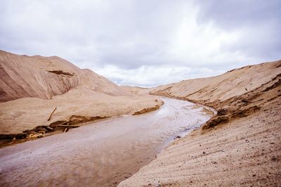 Calm lake along rocky landscape