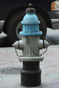 Close-up of fire hydrant on sidewalk