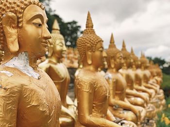 Statue of buddha against building