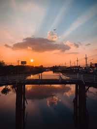 Scenic view of river against sky during sunset