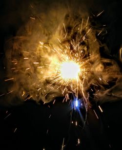 Close-up of firework display at night