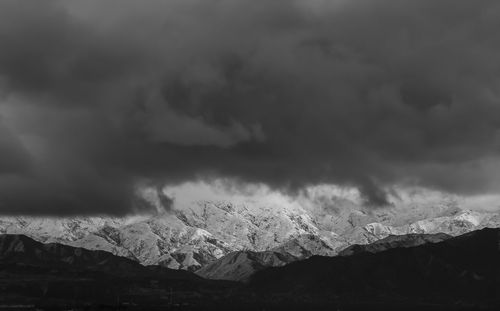 Scenic view of clouds over mountains