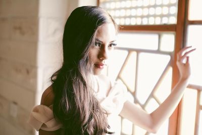 Close-up of young woman at home