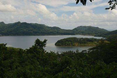 Scenic view of lake and trees against sky