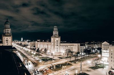 High angle view of buildings in city at night