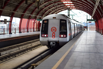 Delhi metro train arriving at jhandewalan metro station in new delhi, india, asia, public metro