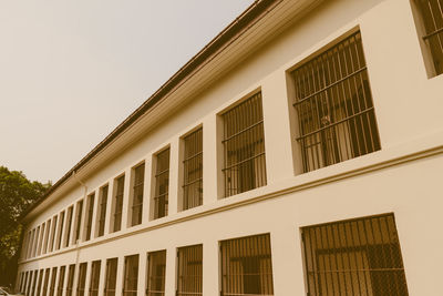 Low angle view of buildings against clear sky