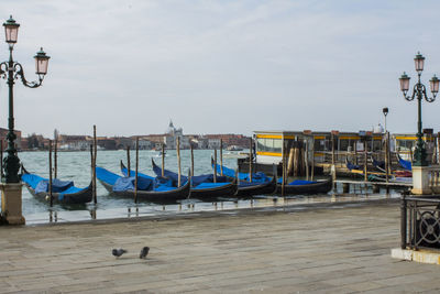View of boats moored in canal
