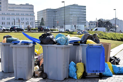 Garbage bin against buildings in city