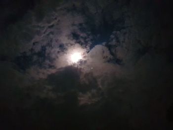 Low angle view of moon in sky at night