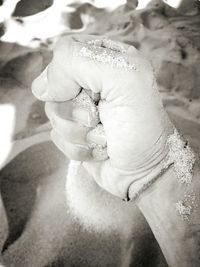 Close-up of hand holding ice cream