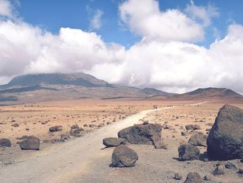 Scenic view of arid landscape against sky