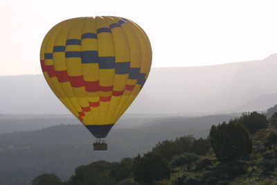 Hot air balloons on mountain landscape