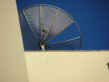 Low angle view of cables against clear blue sky