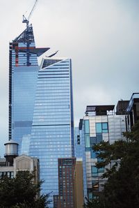 Low angle view of modern buildings against sky