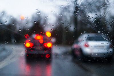 Close-up of wet car window during rainy season