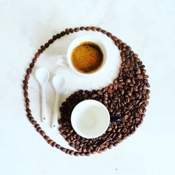 High angle view of coffee bean art on stone table