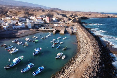 High angle view of townscape by sea