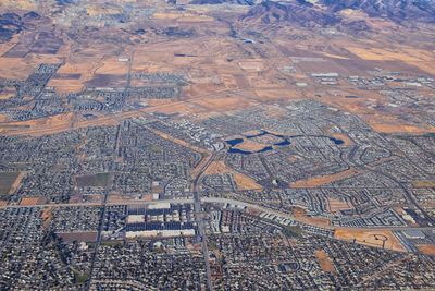 Daybreak lake oquirrh mountains aerial, copper mine, rocky mountains from airplane herriman utah usa