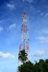 Low angle view of communications tower against sky