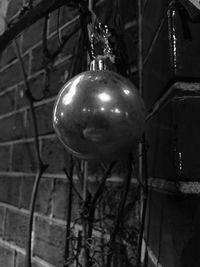 Low angle view of christmas decoration hanging at night