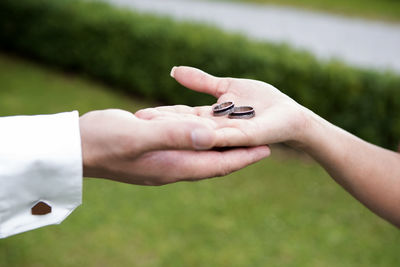 Cropped hand of woman holding hands