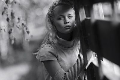 Close-up portrait of young woman standing outdoors