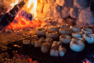 Close-up of burning candles on barbecue