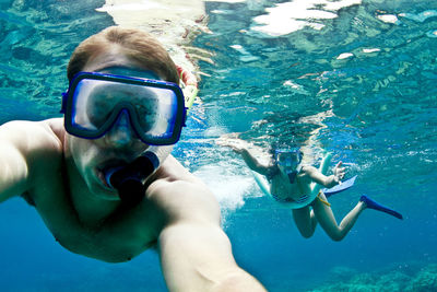 Couple snorkeling undersea