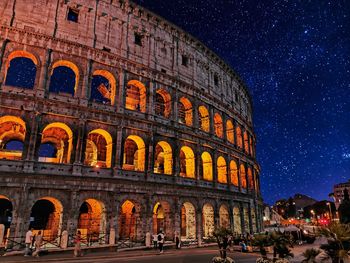 Low angle view of historical building at night