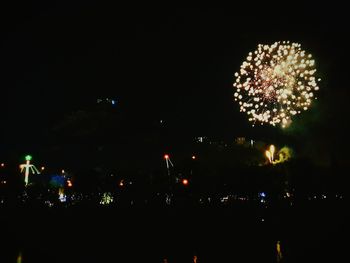 Low angle view of illuminated sky at night