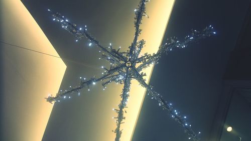Low angle view of illuminated building against sky