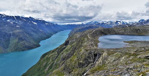 Scenic view of lake and mountains against sky