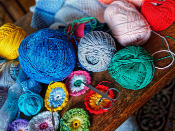 High angle view of wools and crochets on table