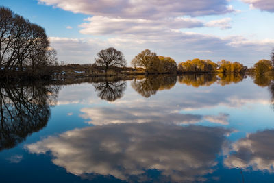 Scenic view of spring river against sky