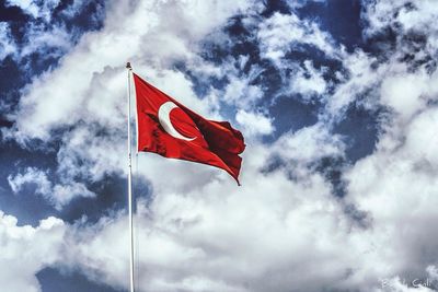 Low angle view of flag against sky