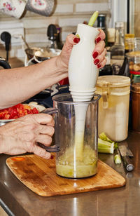 Midsection of man preparing food in kitchen