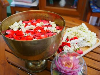 High angle view of roses in bowl on table
