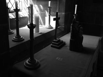 Close-up of objects on table against wall