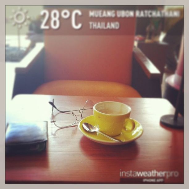 indoors, table, drink, food and drink, refreshment, coffee cup, transfer print, still life, close-up, coffee - drink, freshness, coffee, auto post production filter, saucer, cup, communication, focus on foreground, western script, text, selective focus