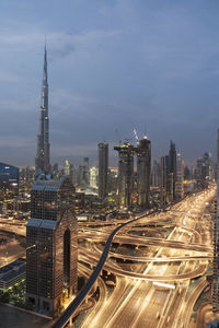 Aerial view of city lit up at night